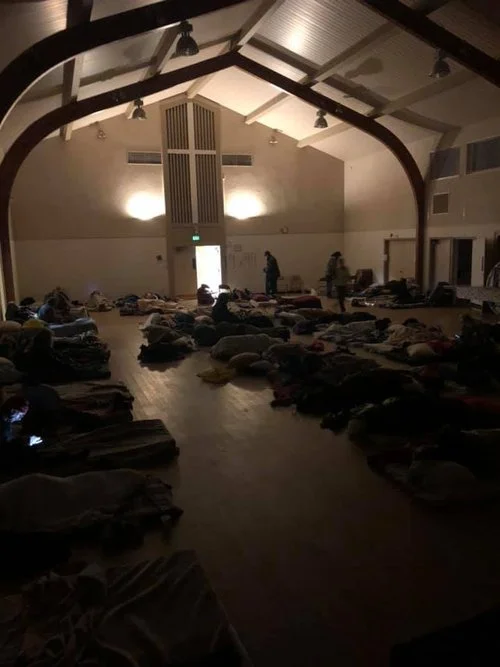 Sleeping spaces arranged inside a winter shelter.